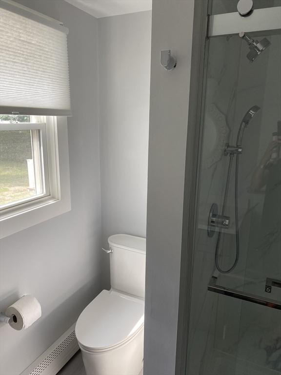 7 Washington St, Groveland, MA 01834 - bathroom with a baseboard radiator and a marble finish shower