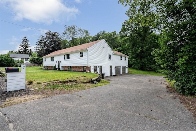 7 Washington St, Groveland, MA 01834 - view of front of house featuring an attached garage, driveway, and a front lawn