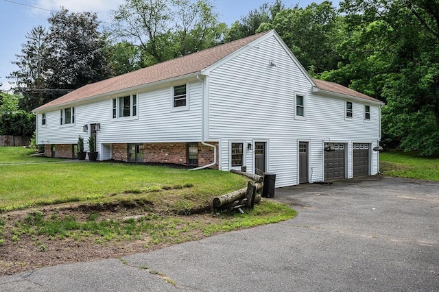 7 Washington St, Groveland, MA 01834 - view of property exterior with asphalt driveway, a garage, a yard, and roof with shingles