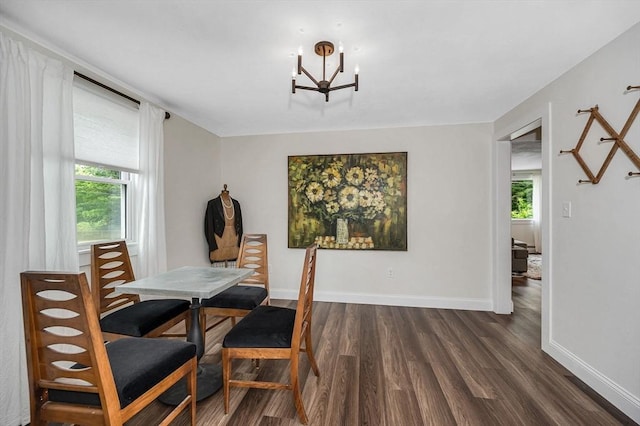 7 Washington St, Groveland, MA 01834 - dining area featuring dark wood finished floors, healthy amount of natural light, and a chandelier