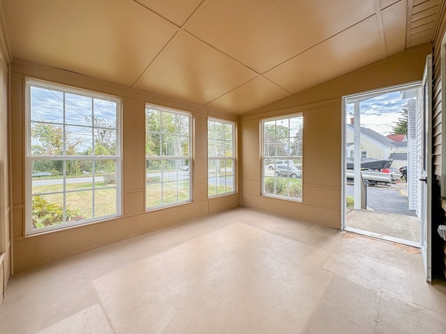 unfurnished sunroom with lofted ceiling and a healthy amount of sunlight