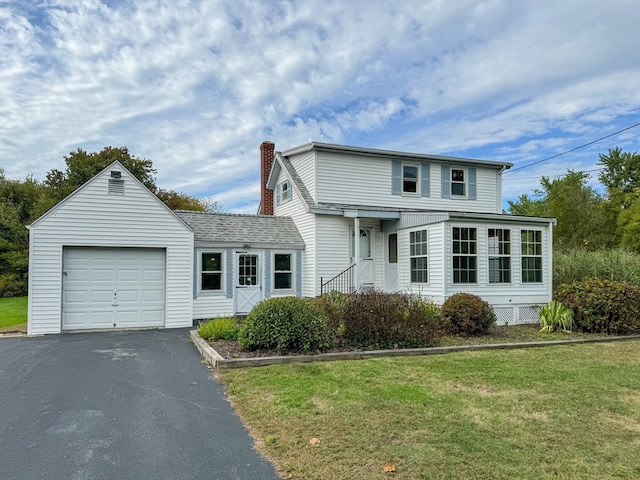 front of property with a front yard and a garage