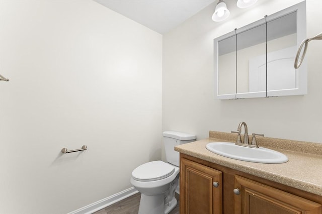 14 Watson St Unit 14, Lowell, MA 01852 - half bathroom featuring vanity and wood finished floors