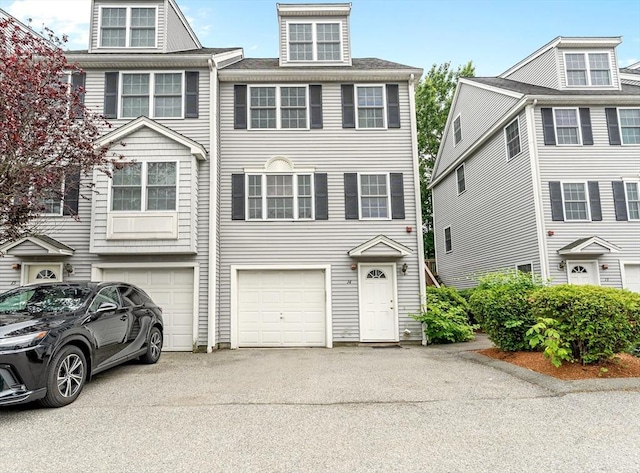 14 Watson St Unit 14, Lowell, MA 01852 - view of property with driveway and a garage