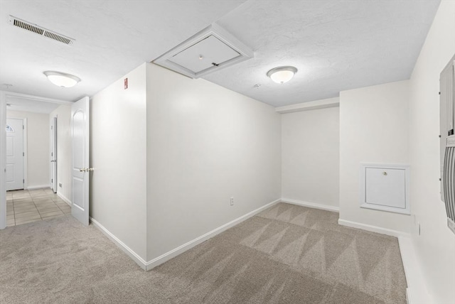 14 Watson St Unit 14, Lowell, MA 01852 - below grade area featuring carpet and a textured ceiling