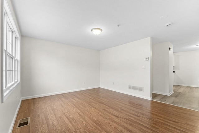 14 Watson St Unit 14, Lowell, MA 01852 - unfurnished room with wood finished floors and fire sprinkler in ceiling