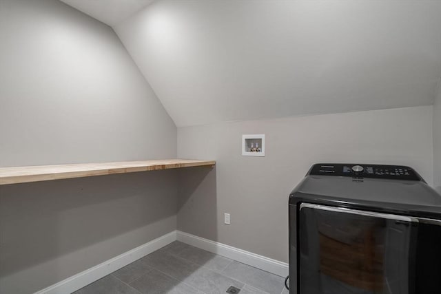 washroom featuring light tile patterned flooring and washer / dryer