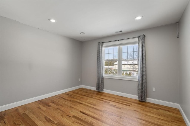 spare room with light wood-type flooring