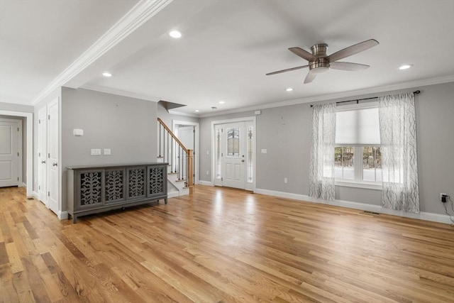 interior space with crown molding, ceiling fan, and light hardwood / wood-style floors