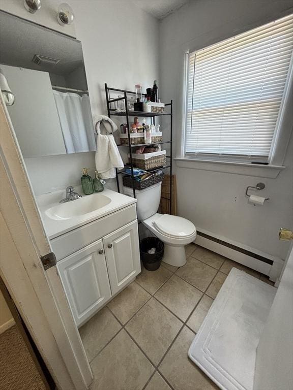 115 Redemption Rock Trl, Sterling, MA 01564 - bathroom featuring a baseboard radiator, vanity, toilet, and tile patterned floors