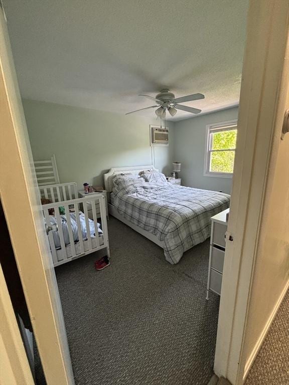 115 Redemption Rock Trl, Sterling, MA 01564 - carpeted bedroom with a wall unit AC, ceiling fan, and a textured ceiling