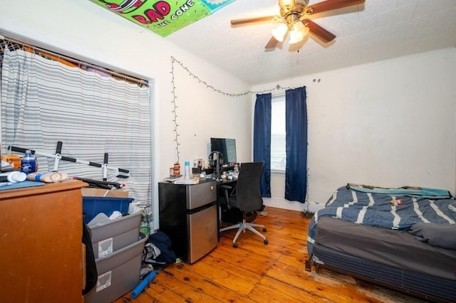 office featuring hardwood / wood-style floors and a ceiling fan