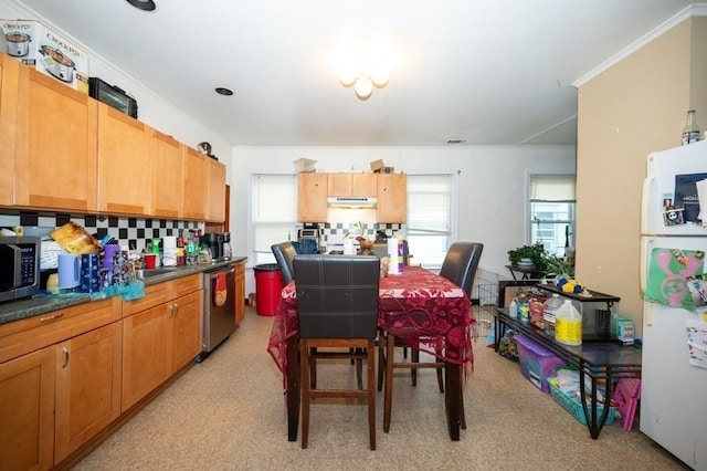 dining area featuring ornamental molding