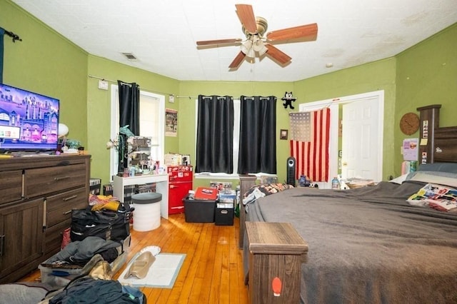 bedroom featuring hardwood / wood-style flooring and ceiling fan