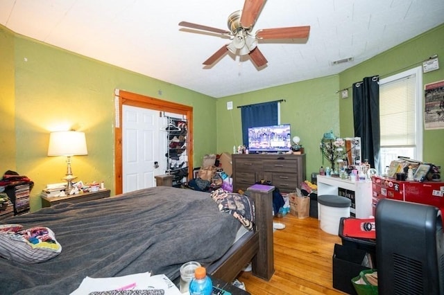 bedroom featuring wood finished floors and ceiling fan