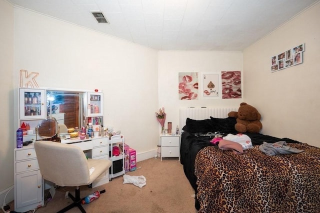 bedroom with light carpet and ornamental molding