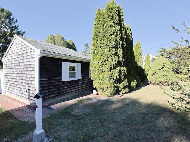 view of side of home featuring a yard