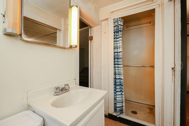 bathroom with vanity and walk in shower