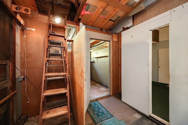 interior space featuring wood walls