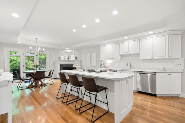 12 Scotland Dr, Andover, MA 01810 - kitchen with dishwasher, a tray ceiling, recessed lighting, a center island, and a sink