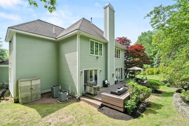 12 Scotland Dr, Andover, MA 01810 - back of property featuring a yard, a chimney, a wooden deck, and central AC