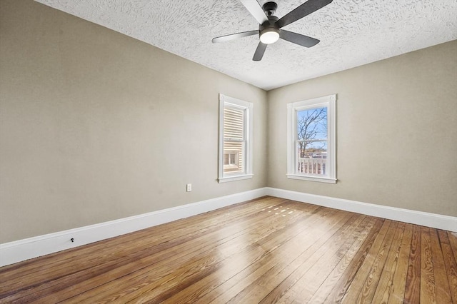 18 Lyon St Unit 2, Boston, MA 02122 - spare room featuring light wood-style floors, baseboards, a ceiling fan, and a textured ceiling