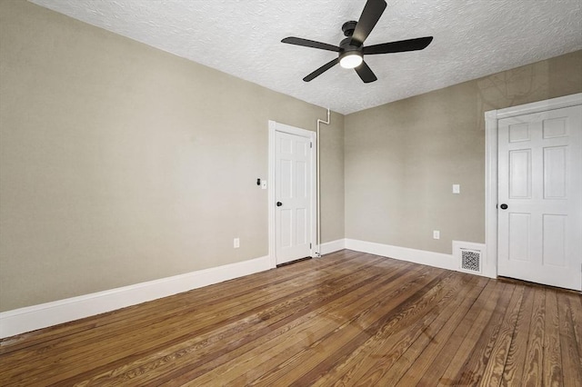 18 Lyon St Unit 2, Boston, MA 02122 - unfurnished bedroom with a textured ceiling, hardwood / wood-style flooring, baseboards, and a ceiling fan