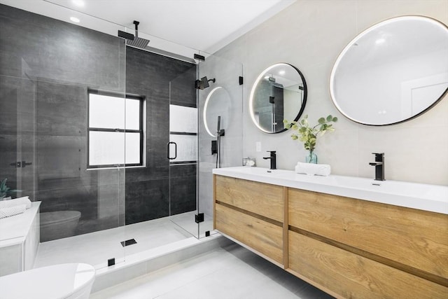 42 Bower St Unit 2, Medford, MA 02155 - full bathroom with toilet, double vanity, a stall shower, and tile patterned flooring