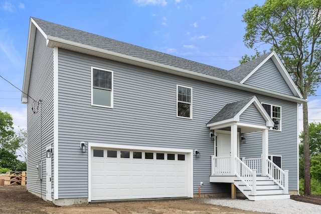 4 Bronson St, Fall River, MA 02721 - traditional home with a garage, a shingled roof, and driveway
