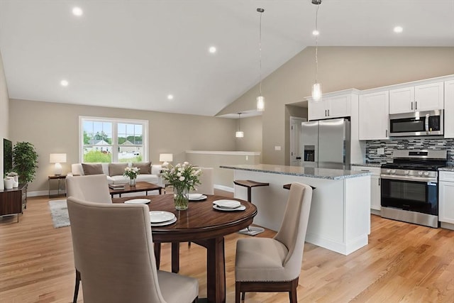 4 Bronson St, Fall River, MA 02721 - dining area featuring light wood-style flooring, high vaulted ceiling, and recessed lighting