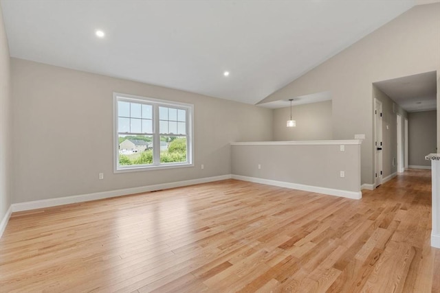 4 Bronson St, Fall River, MA 02721 - empty room with vaulted ceiling, light wood-style floors, and recessed lighting