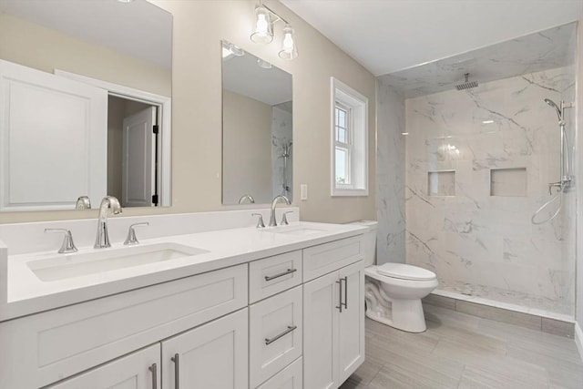 4 Bronson St, Fall River, MA 02721 - bathroom featuring double vanity and a marble finish shower