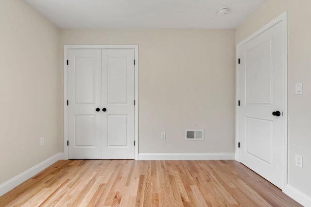 4 Bronson St, Fall River, MA 02721 - unfurnished bedroom with light wood-style floors and a closet