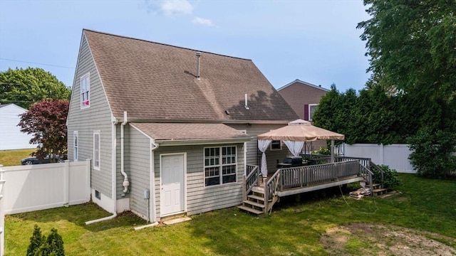 217 Hathaway Commons Rd, Fall River, MA 02720 - rear view of house featuring a gazebo, roof with shingles, a wooden deck, and a fenced backyard