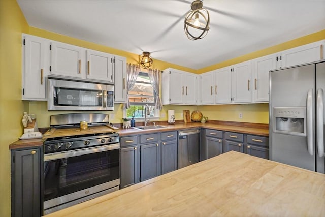 217 Hathaway Commons Rd, Fall River, MA 02720 - kitchen featuring stainless steel appliances, white cabinets, and wood counters