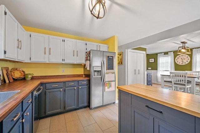 217 Hathaway Commons Rd, Fall River, MA 02720 - kitchen featuring stainless steel fridge, butcher block countertops, white cabinetry, blue cabinets, and dishwasher