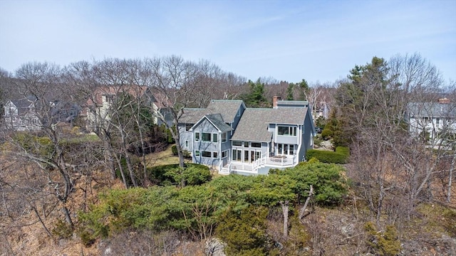 17 Wagon Wheel Rd, Winchester, MA 01890 - back of property featuring a shingled roof, a balcony, and a chimney