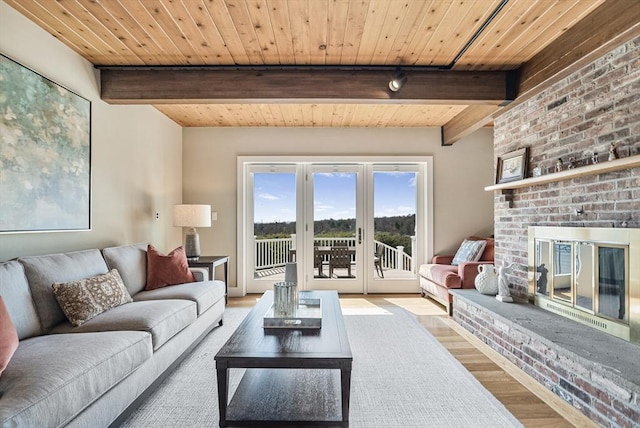 17 Wagon Wheel Rd, Winchester, MA 01890 - living room featuring wood finished floors, wood ceiling with exposed beams, and a brick fireplace
