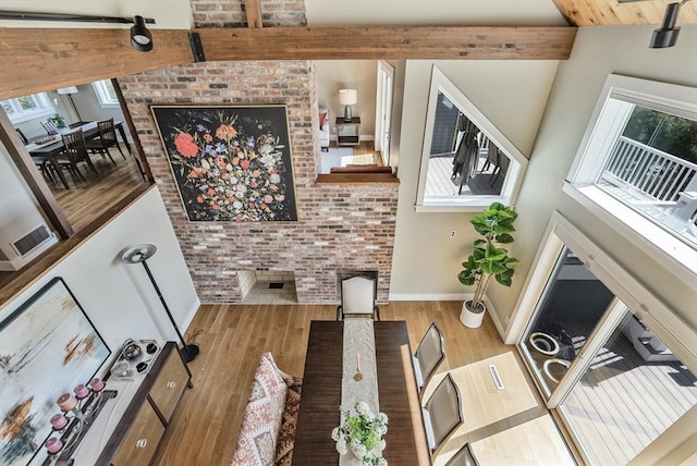 17 Wagon Wheel Rd, Winchester, MA 01890 - dining space featuring wood finished floors, baseboards, and a fireplace