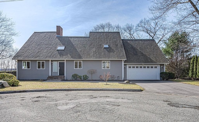 17 Wagon Wheel Rd, Winchester, MA 01890 - view of front of house with a chimney, driveway, a garage, and a shingled roof