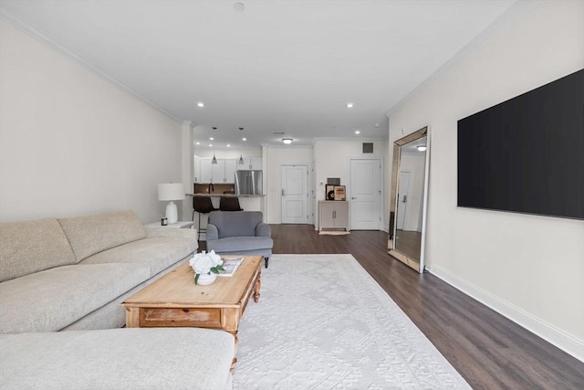 69 Foundry St Unit 305, Wakefield, MA 01880 - living area with dark wood-style flooring, recessed lighting, and ornamental molding