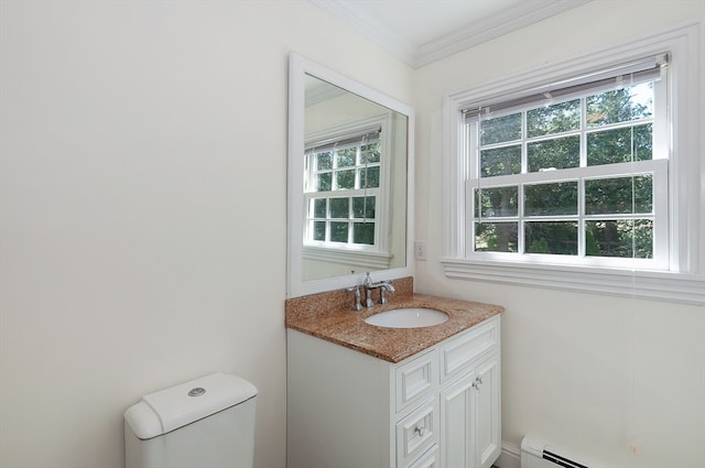 bathroom featuring baseboard heating, a healthy amount of sunlight, toilet, and vanity