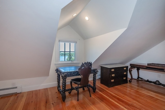 office area with lofted ceiling, baseboard heating, and hardwood / wood-style flooring