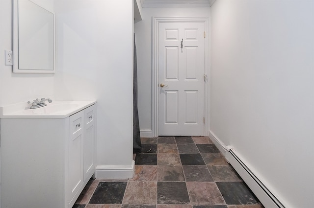 bathroom with a baseboard heating unit and vanity