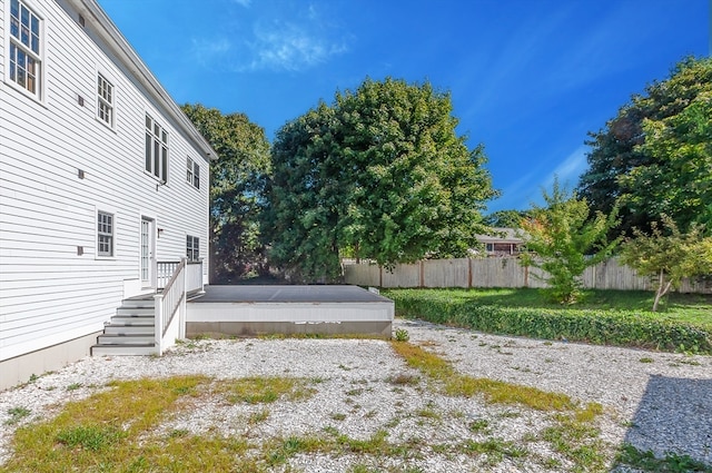 view of yard featuring a wooden deck