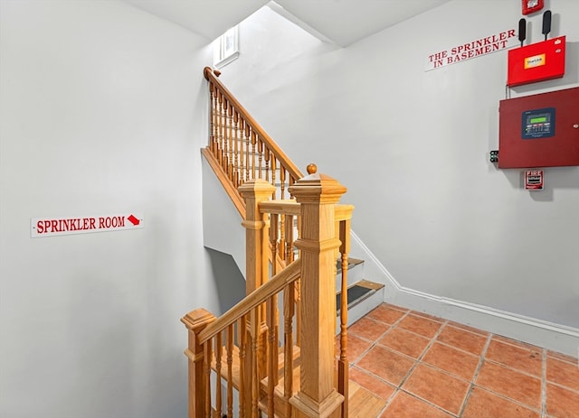 stairs featuring tile patterned floors