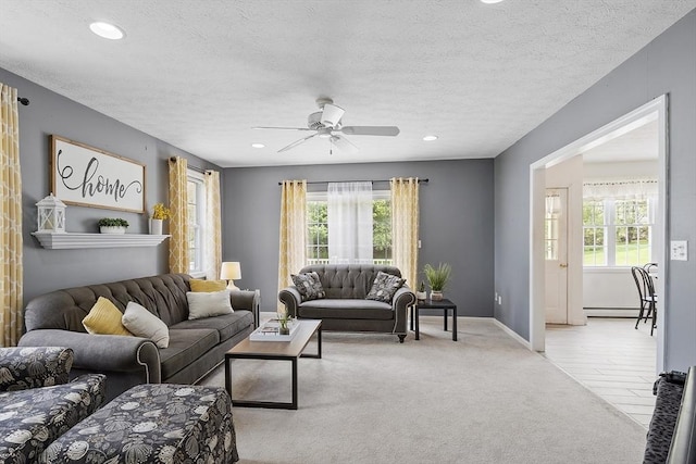 4 Quail Run Dr, Methuen, MA 01844 - living area featuring a baseboard radiator, plenty of natural light, a ceiling fan, a textured ceiling, and recessed lighting