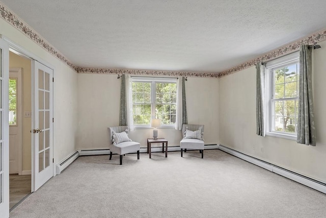 4 Quail Run Dr, Methuen, MA 01844 - living area with a baseboard radiator, plenty of natural light, a textured ceiling, and carpet