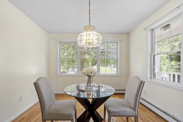 4 Quail Run Dr, Methuen, MA 01844 - dining space with a baseboard radiator, light wood-style floors, baseboards, and a chandelier