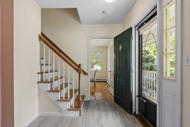 4 Quail Run Dr, Methuen, MA 01844 - entrance foyer with wood finished floors, stairway, and baseboards